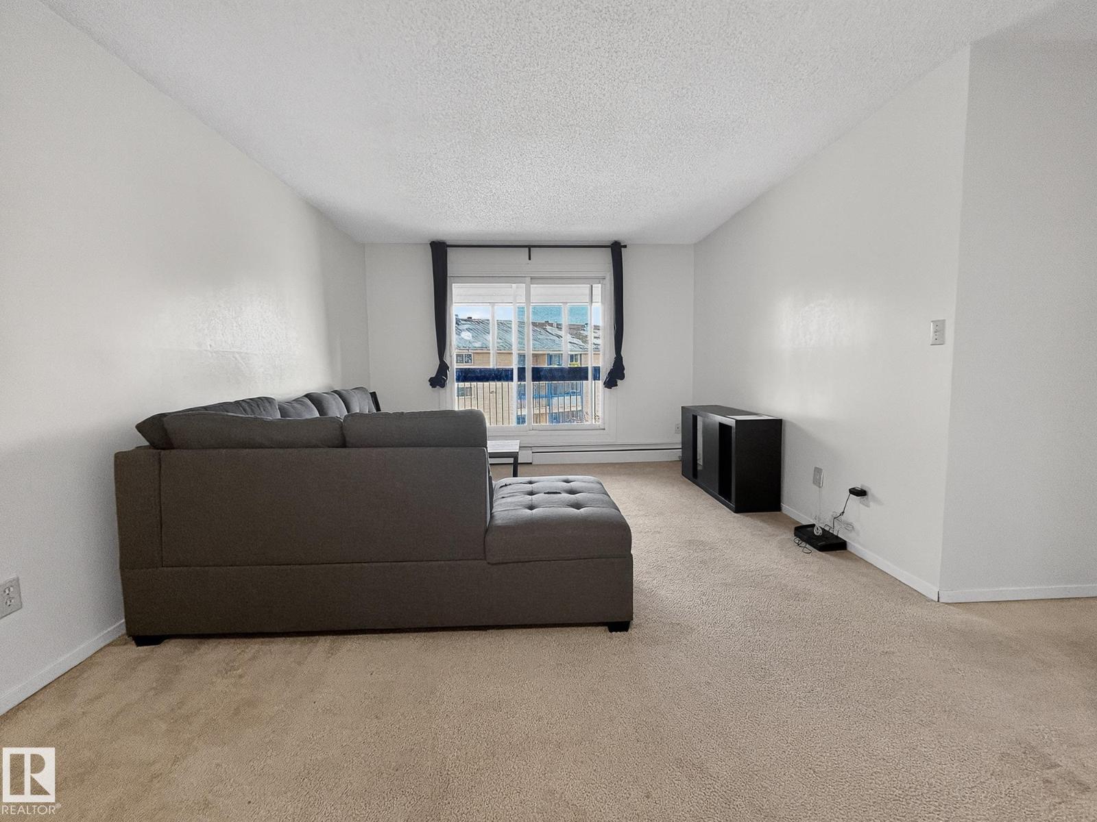 #406 2620 MILL WOODS RD E NW